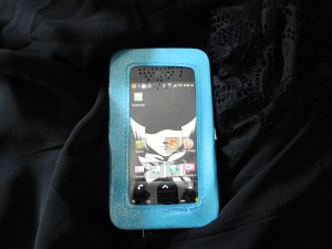 Front has protective plastic window with an opening on bottom for a button (or camera?) and then speaker holes at the top. I couldn't decide which way the phone was ment to go in, lol. And yeah, Alan Walker from D-Grayman is my wallpaper! :P